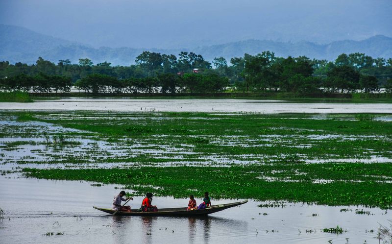 Family in a boat — photograph by Ajmain Fayek
