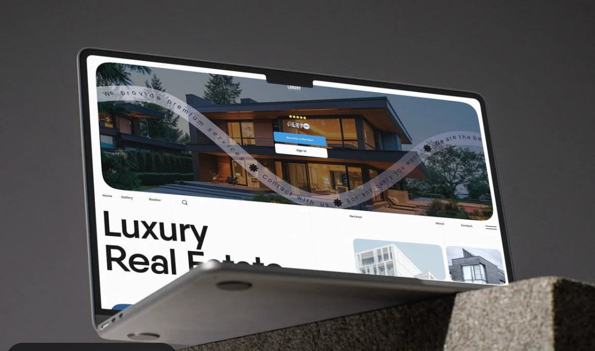Luxury real estate website displayed on a laptop mockup